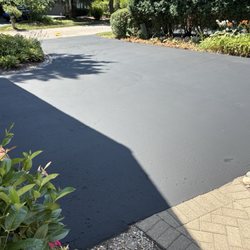 Stringer Blacktop Sealcoating - Clean lines by my brick and garage!!