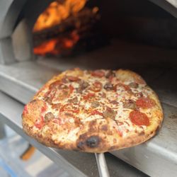 Baked By Small Batch - Meat Lovers Pizza made with Sausage, Pepperoni and Bacon