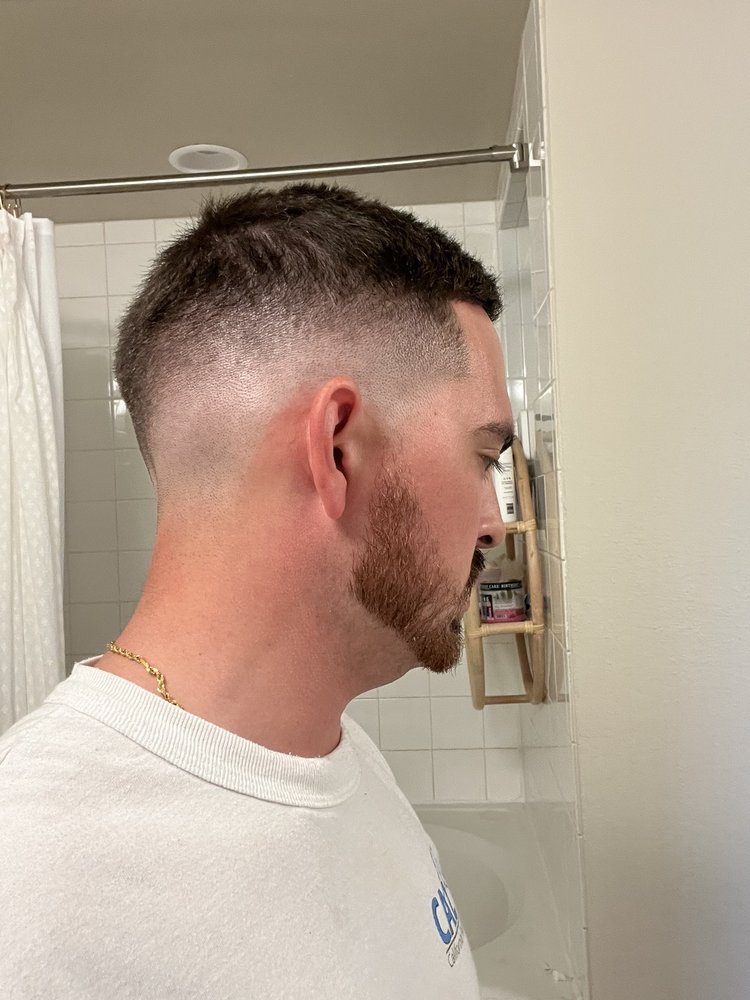 Revolt Barbershop Logo
