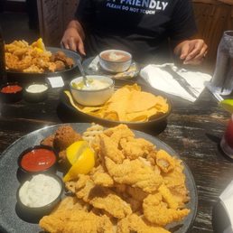 Catfish plate, seafood platter, red beans and rice, queso and chips, and mar-no-Rita