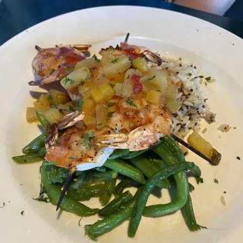 Black Pelican - Shrimp skewers with rice and beans, with a pineapple orange glaze. - Seafood Near Me - Kitty Hawk, North Carolina Black Pelican - Shrimp skewers with rice and beans, with a pineapple orange glaze. - Seafood Near Me - Kitty Hawk, North Carolina