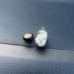 The Crystal Garden - Tree agate crystal in a wire cage and a small obsidian crystal