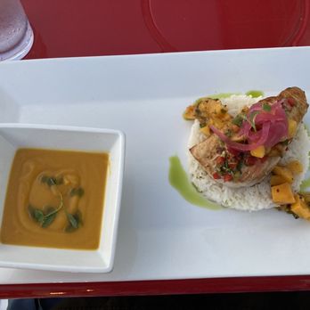 Sam & Maggie's Dockside Grill - Mahi Mahi with Mango in a coconut yam cream sauce and an avocado cream sauce on a bed of rice - Caribbean Near Me - Pasadena, Maryland Sam & Maggie's Dockside Grill - Mahi Mahi with Mango in a coconut yam cream sauce and an avocado cream sauce on a bed of rice - Caribbean Near Me - Pasadena, Maryland