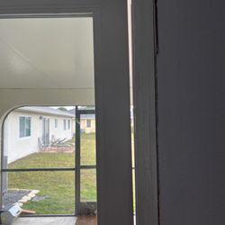 Homefix Custom Remodeling - That is the stationary door before they installed the bracket which was "forgotten" to be installed 2 weeks ago.