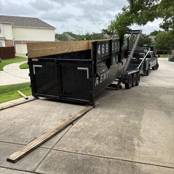 Cowtown Waste Removal - Boards placed to protect the driveway. Pro move. - Dumpster Rental Near Me Cowtown Waste Removal - Boards placed to protect the driveway. Pro move. - Dumpster Rental Near Me