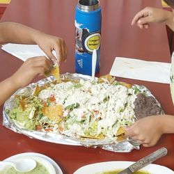 Esposito's Pizza & Mexican Food - Giant plate of veggie nachos with extra beans.