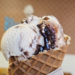 Close-up of a Waffle Cone with a scoop of Peanut Butter Fudge Ice Cream.