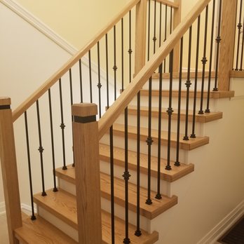 Q Flooring - a staircase with a wooden handrail - Flooring Near Me - Mississauga, Ontario Q Flooring - a staircase with a wooden handrail - Flooring Near Me - Mississauga, Ontario