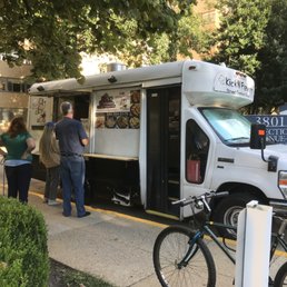 a food truck parked on the side of the road a food truck parked on the side of the road