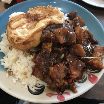 DAKZEN - My basil moo grob topped w/ fried over easy egg over a bed of rice!!! Bomb!!! - Thai Near Me - Somerville, Massachusetts