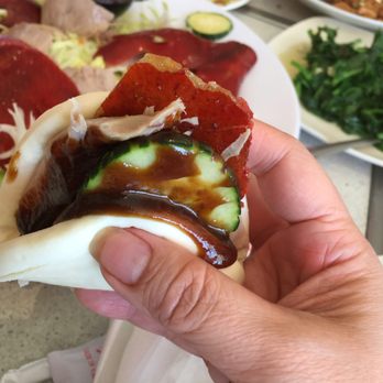 Tan Tan - Peking duck with cucumber and hoisin sauce in a steamed bun - Chinese Near Me - Houston, Texas Tan Tan - Peking duck with cucumber and hoisin sauce in a steamed bun - Chinese Near Me - Houston, Texas