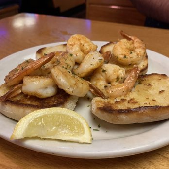 Texas Roadhouse - Shrimp appetizer served over grilled bread and drizzled with garlic butter - Steakhouses Near Me - Oceanside, California Texas Roadhouse - Shrimp appetizer served over grilled bread and drizzled with garlic butter - Steakhouses Near Me - Oceanside, California