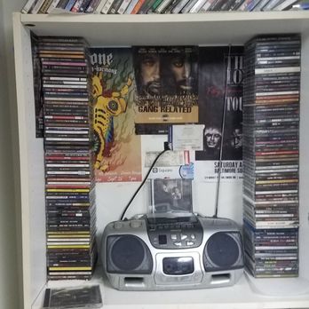 The Gallery About Nothing - Mini Hip-Hop Museum. Aida portable CD/Cassette boom box surrounded by cassette tapes and CD's. - Paint & Sip Near Me - Baltimore, Maryland