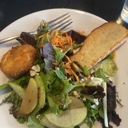 Lovely fresh greens with goat cheese and apple slices with a vinaigrette. This is the small size. Lovely fresh greens with goat cheese and apple slices with a vinaigrette. This is the small size.