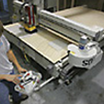 Solid Advantage - a man working on a machine - Flooring Near Me - Derry, New Hampshire