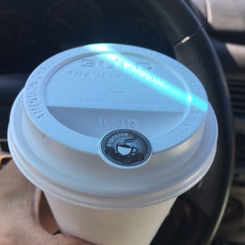 Daily Espresso - a hand holding a cup of coffee - Coffee & Tea Near Me - Draper, Utah