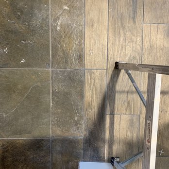 Home Improvements By King Services - Installed a transition saddle between wood tile and slate floor. Great idea - General Contractors Near Me - Centereach, New York