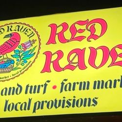 Red Raven Surf And Turf - The sign above the entrance.
