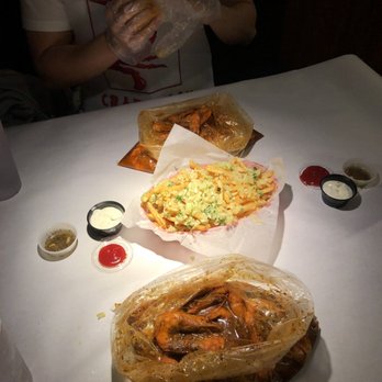 Ray's Crab Shack - In the middle garlic fries and outside are the pound of shrimp with ultimate power sauce ! - Seafood Near Me - Newark, California Ray's Crab Shack - In the middle garlic fries and outside are the pound of shrimp with ultimate power sauce ! - Seafood Near Me - Newark, California