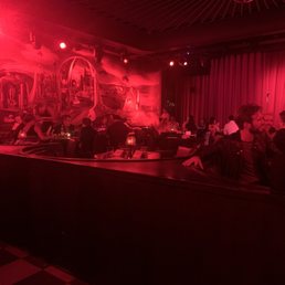 a group of people sitting at a bar