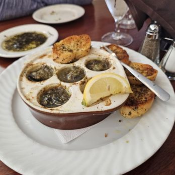 Salt Rock Grill - Escargot, 6 in boiling butter and bread. - New American Near Me - Indian Shores, Florida Salt Rock Grill - Escargot, 6 in boiling butter and bread. - New American Near Me - Indian Shores, Florida