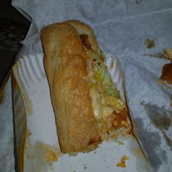 Cheshire Village Pizza - half eaten sandwich on paper plate - Pizza Near Me - Keene, New Hampshire
