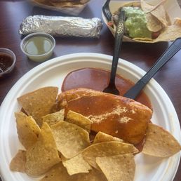 Pork tamale and Carne Asada taco served with tortilla chips and tortillas Pork tamale and Carne Asada taco served with tortilla chips and tortillas
