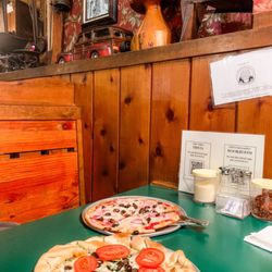 Inside restaurant booth area, collection of antiques