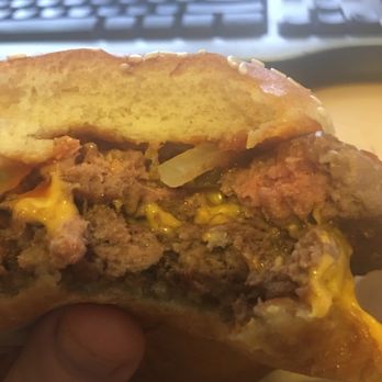McDonald's - a hand holding a hamburger - Fast Food Near Me - Mustang, Oklahoma McDonald's - a hand holding a hamburger - Fast Food Near Me - Mustang, Oklahoma