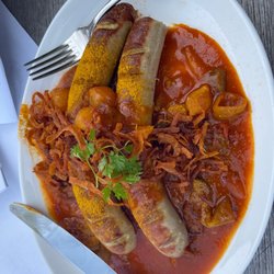 Restaurant Puricelli - Unsere currywurst spezial (veal sausage)