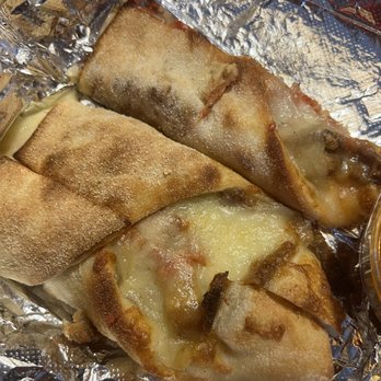 Loretta's Pizza - Unassuming Eggplant Parm Calzone. Don't be fooled. Very good. - Pizza Near Me - Bronx, New York