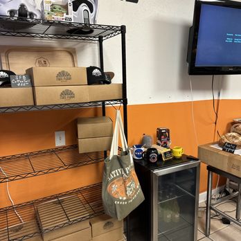 State Flour Bakery - shelves of food and a television - Bakeries Near Me - Tampa, Florida