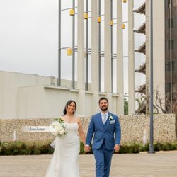 Gustavo Villarreal Professional Photography & Video - Bride and groom walking, smiling and posing for photos after ceremony outside of the Christ  Cathedral in Garden Grove Ca.