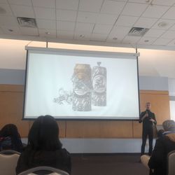 Nassau Community College - CCB room 252 Graphic Design Artist Mr. Gutsulyak giving presentation viewed on screen