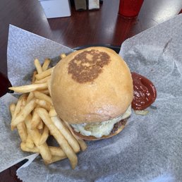 Sourdough bun with pepper, jack cheese, and grilled onions