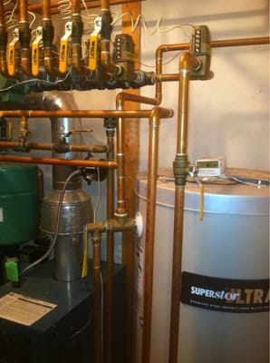 T.Q. Plumbing & Heating Logo