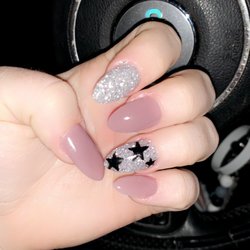 TP Nails & Spa - Almond nails with star design!