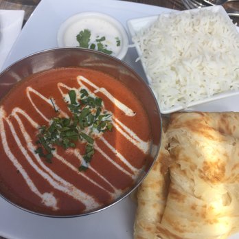 Kathakali - lunch special: butter chicken, malabar parotta, chilled raita and hot chai tea (not pictured) - Indian Near Me - Kirkland, Washington Kathakali - lunch special: butter chicken, malabar parotta, chilled raita and hot chai tea (not pictured) - Indian Near Me - Kirkland, Washington