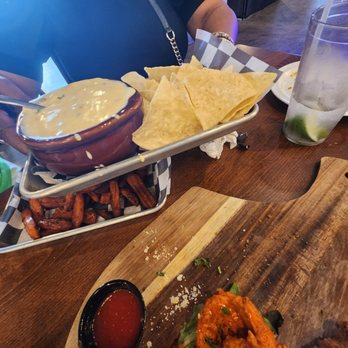 KNP Social - Queso and chips- didnt taste it but it was thick! - Axe Throwing Near Me - Pearland, Texas KNP Social - Queso and chips- didnt taste it but it was thick! - Axe Throwing Near Me - Pearland, Texas