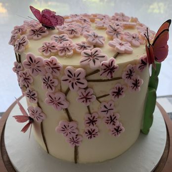Daylight Donuts - a cake decorated with pink flowers and a butterfly - Donuts Near Me - Farmers Branch, Texas Daylight Donuts - a cake decorated with pink flowers and a butterfly - Donuts Near Me - Farmers Branch, Texas