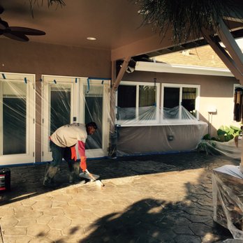 Premier Remodeling & Design - a man painting a patio - General Contractors Near Me - Encino Ca, California Premier Remodeling & Design - a man painting a patio - General Contractors Near Me - Encino Ca, California