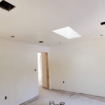 Mass Building Solutions - an empty room with a skylight - General Contractors Near Me - Bedford, Massachusetts