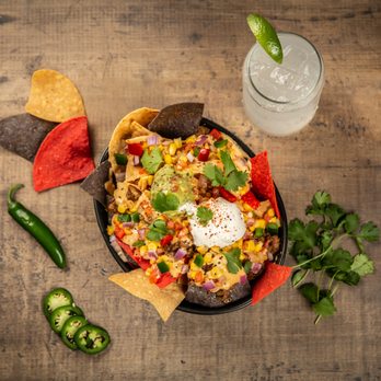 Saracen Express - a bowl of nachos with chips and a glass of water - Pizza Near Me - Pine Bluff, Arkansas Saracen Express - a bowl of nachos with chips and a glass of water - Pizza Near Me - Pine Bluff, Arkansas