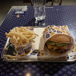 Double cheeseburger with small fries. Double cheeseburger with small fries.