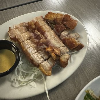 Side Street Inn - Crispy Skin Roast Pork served with Chinese style hot mustard & shoyu....Surprised it wasn't served with Ketchup ($20) - Sports Bars Near Me - Honolulu, Hawaii