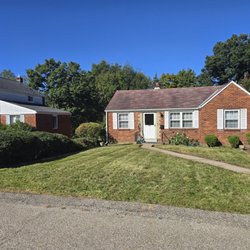 Bill's Kid Lawn Service - Two holly bushes removed from under a window, remaining shrubs pruned and reshaped