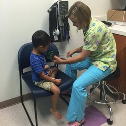 Capital Area Pediatrics - Falls Church - Nurse taking blood pressure