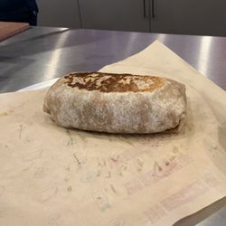 Quesada Burritos & Tacos - Neatly wrapped chicken burrito
