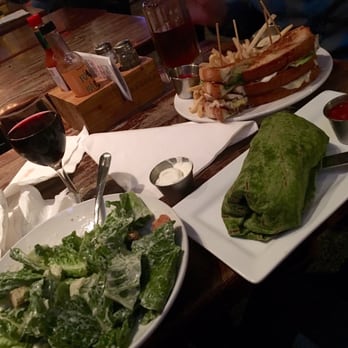 Bardog Tavern - Monster burrito with a small Caesar salad & an island club sandwich in the back - Bars Near Me - Memphis, Tennessee