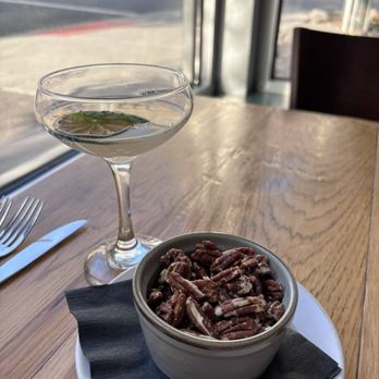 The Blackbird Restaurant - Spiced pecans and Herbal Remedy (rosemary, basil, lime and club soda) - Southern Near Me - Asheville, North Carolina The Blackbird Restaurant - Spiced pecans and Herbal Remedy (rosemary, basil, lime and club soda) - Southern Near Me - Asheville, North Carolina